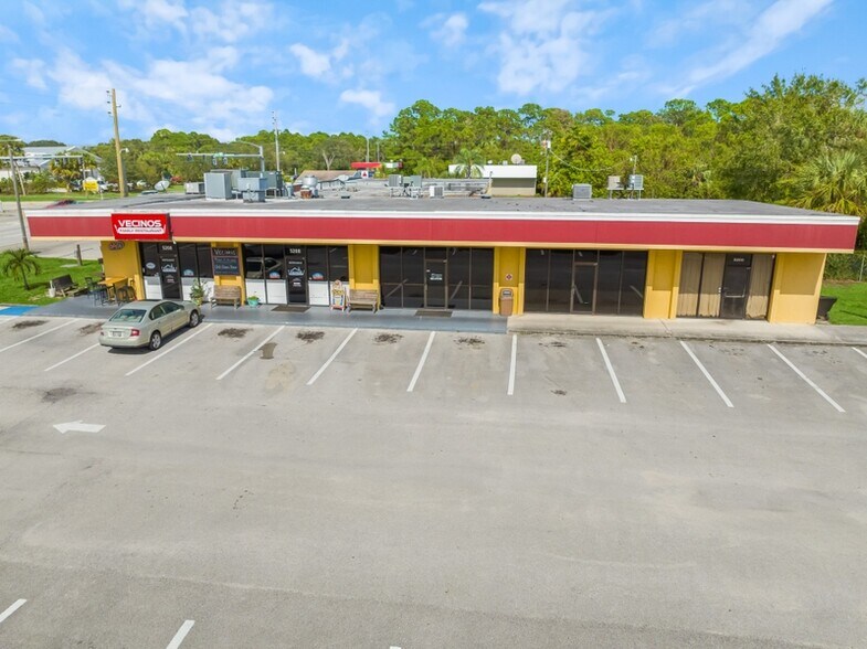 Primary Photo Of 5180-5186 Turnpike Feeder Rd, Fort Pierce General Retail For Sale