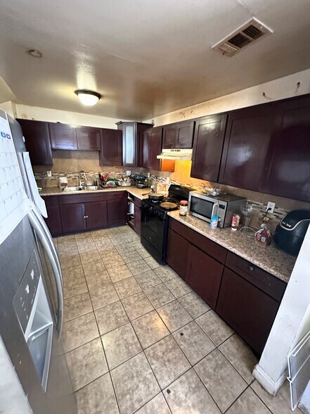 More Photos Of 9123 Orchard Ave, Los Angeles Multifamily For Sale