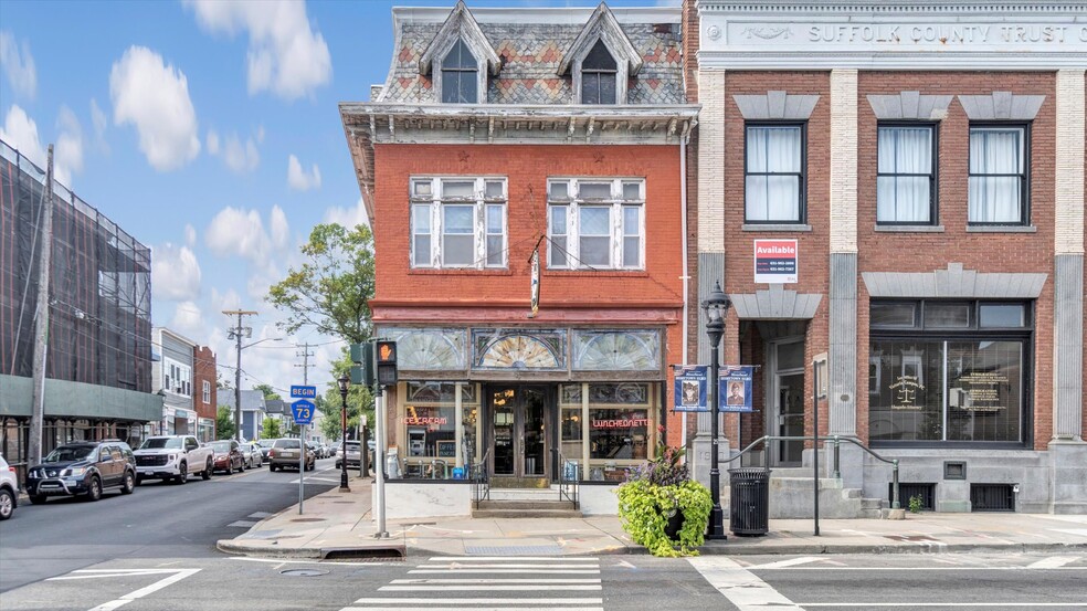 Primary Photo Of 4 E Main St, Riverhead Storefront Retail Office For Sale