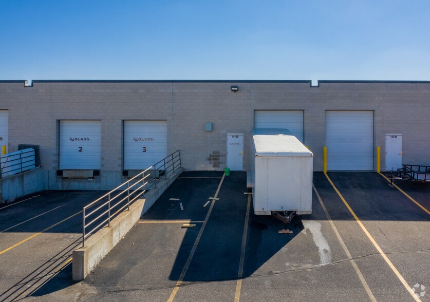 More Photos Of 14140-14198 Northdale Blvd, Rogers Showroom For Lease