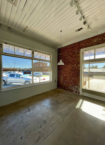 More Photos Of Block of South Baylor Commerce and S. St. Charles St, Brenham Storefront Retail Office For Sale