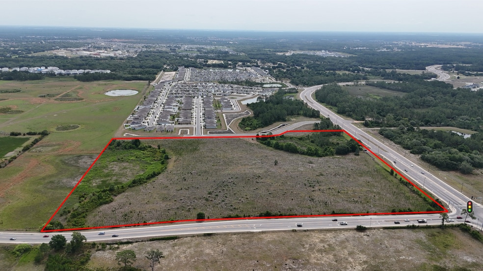 Primary Photo Of Ernie Caldwell Blvd @ Pine Tree Trail, Davenport Land For Sale