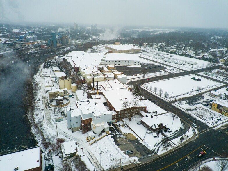 Primary Photo Of 1 River St, South Glens Falls Manufacturing For Sale