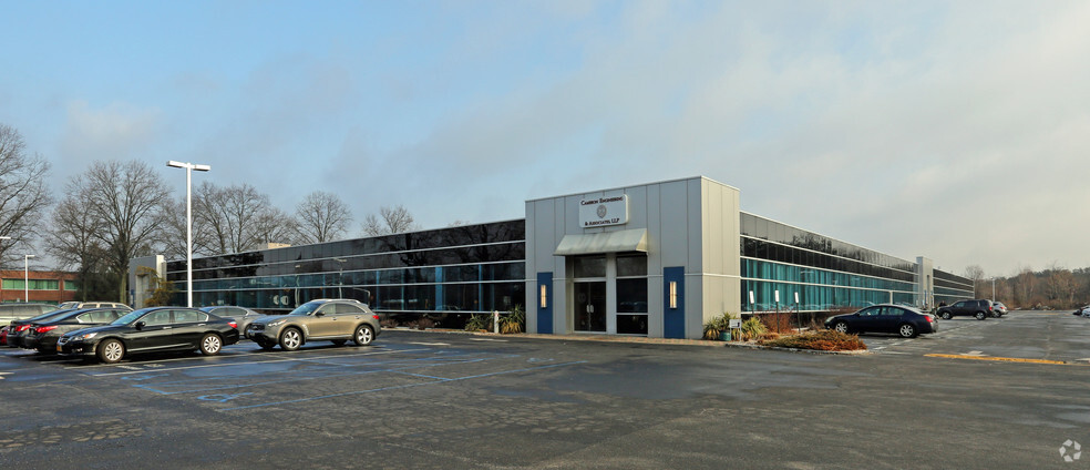 Primary Photo Of 100 Sunnyside Blvd, Woodbury Office For Sale