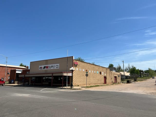 Primary Photo Of 402 North Main, Cement Showroom For Sale