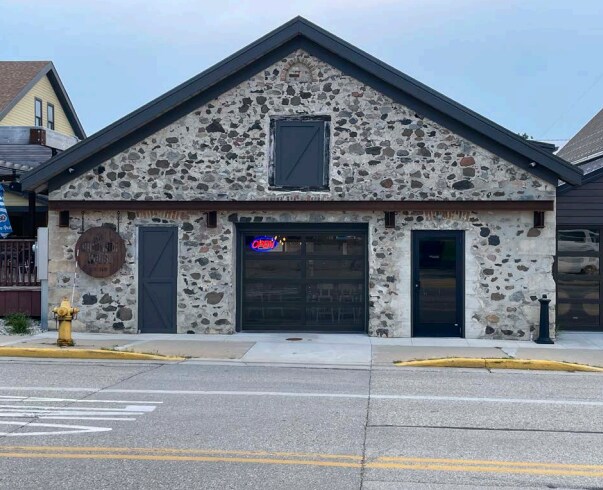 Primary Photo Of 100 W Washington St, Slinger General Retail For Sale