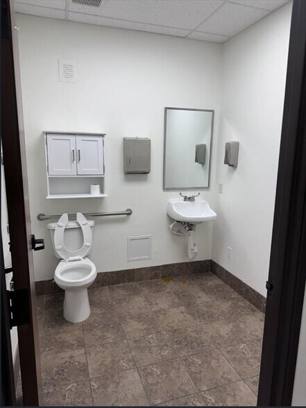 More Photos Of 10717 N May Ave, The Village Storefront For Lease