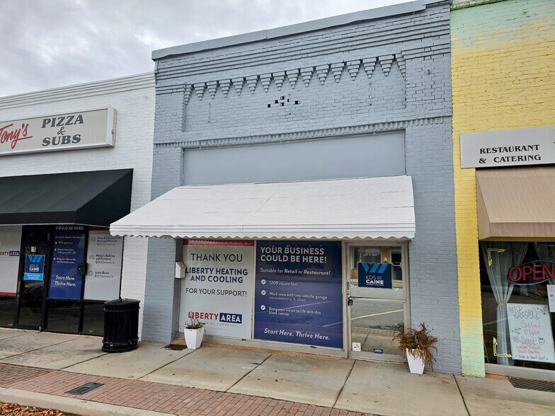 Primary Photo Of 27 S Commerce St, Liberty Storefront For Sale