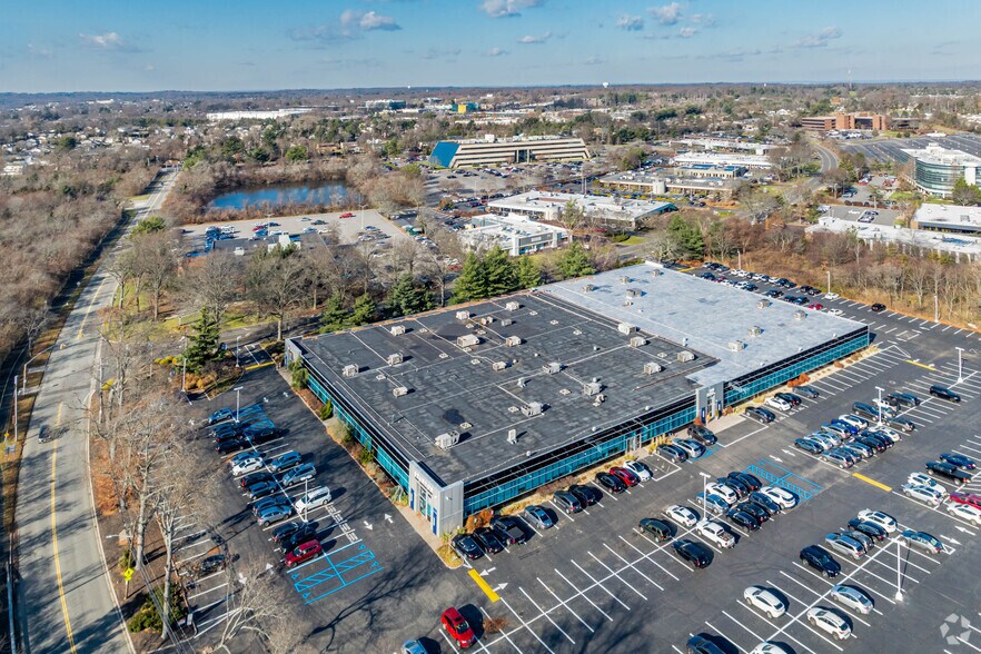 More Photos Of 100 Sunnyside Blvd, Woodbury Office For Lease