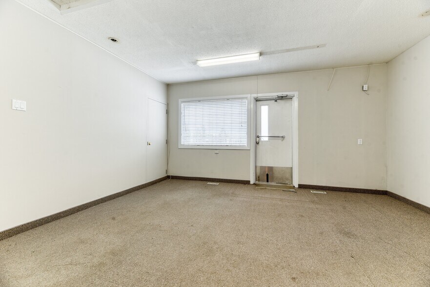 More Photos Of 228 Centre St NE, Langdon Flex For Sale