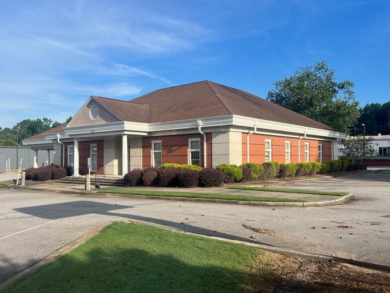 Primary Photo Of 1302 W Spring St, Monroe Bank For Sale