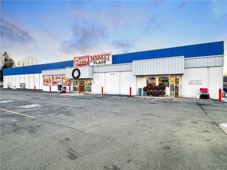 Primary Photo Of 121 N Center St, Perry Service Station For Sale