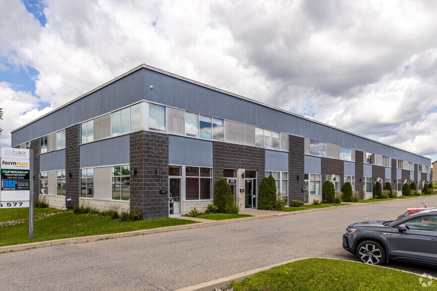 Primary Photo Of 557-577 Boul du Curé-Boivin, Boisbriand Warehouse For Sale