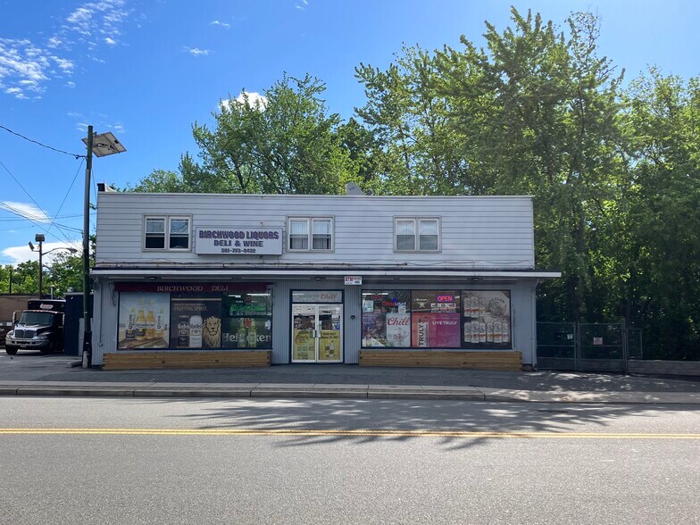 Primary Photo Of 545 Mola Blvd, Elmwood Park Storefront Retail Residential For Sale