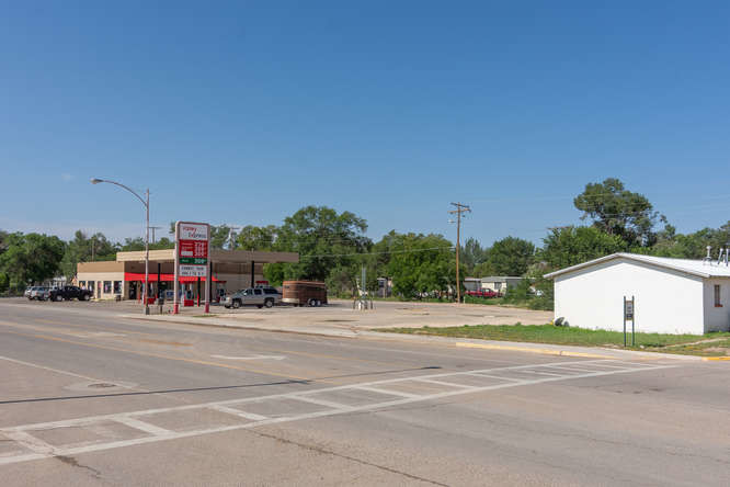 Primary Photo Of 115 S 5th St, Estancia Convenience Store For Sale