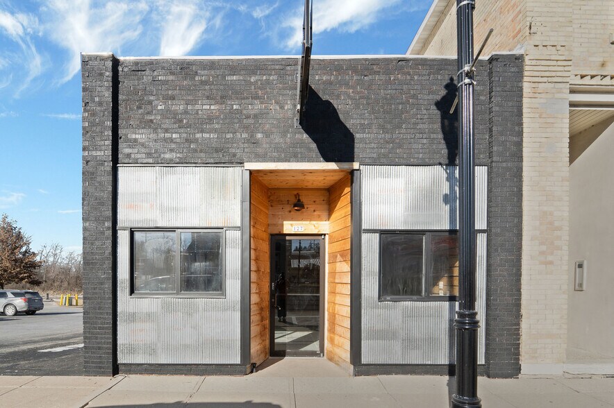 Primary Photo Of 127 W Main St, Omro Storefront Retail Office For Sale