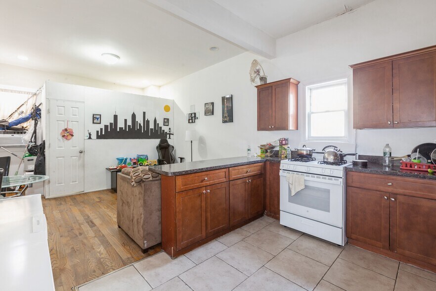 More Photos Of 100-10-100-12 103rd Ave, Ozone Park Multifamily For Sale
