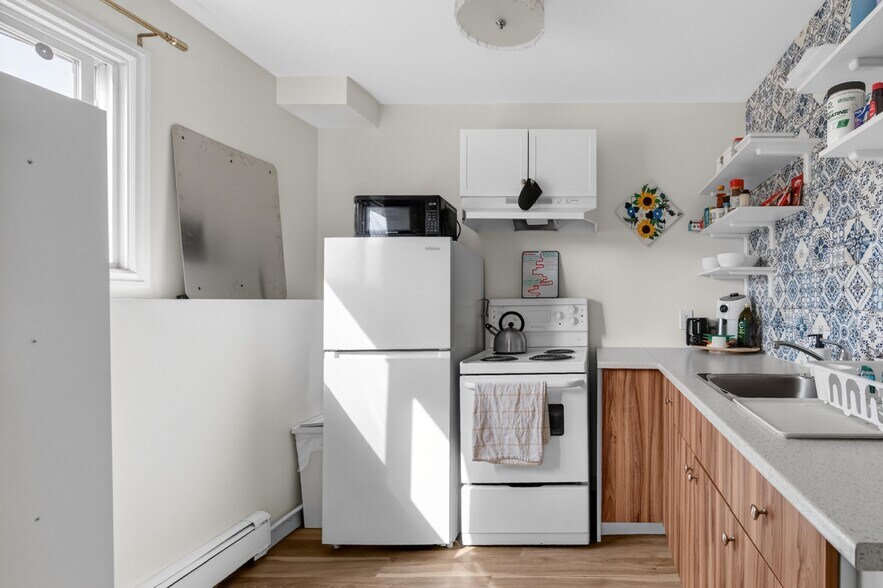 More Photos Of 5015 48 St, Legal Apartments For Sale