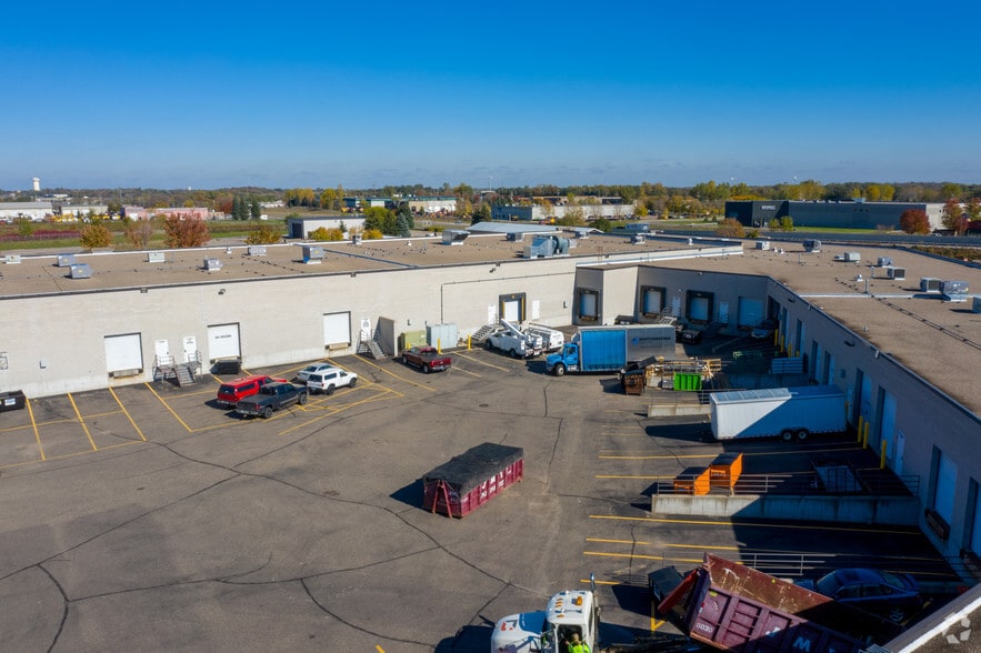 More Photos Of 14140-14198 Northdale Blvd, Rogers Showroom For Lease